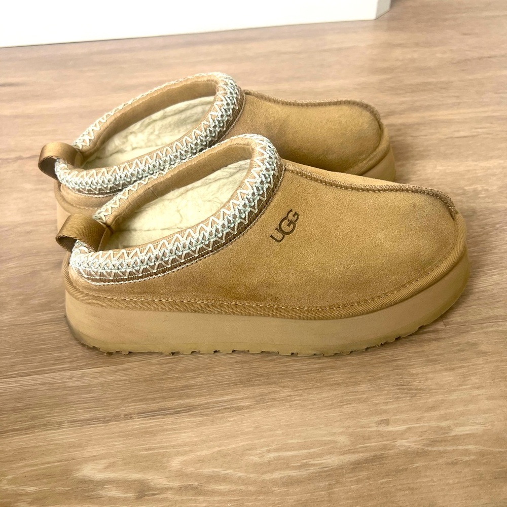 Only worn a few time, super comfy Ugg slippers. Tan with blue thread work